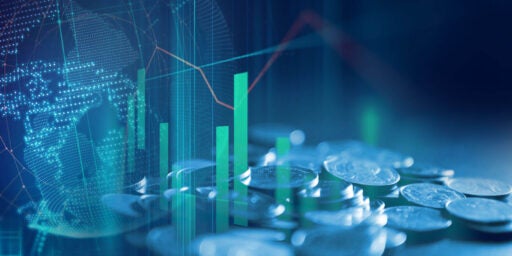 Image of coins close up with financial graph overlay.