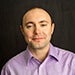 Headshot of Andrey Madan, director of solution engineering at Parasoft