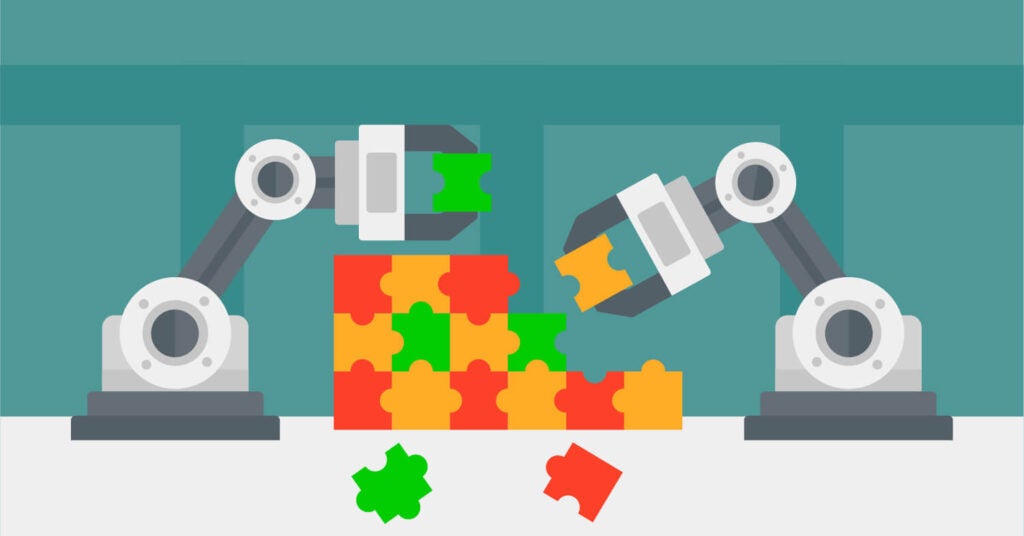 Deux bras robotiques construisant un puzzle coloré.