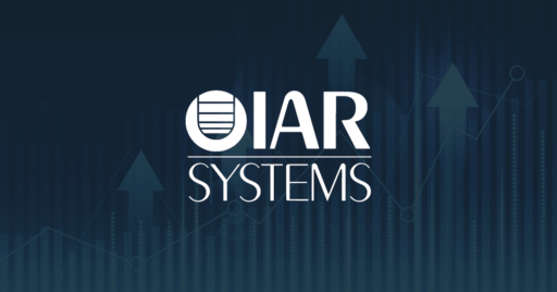 Graphic in a variety of blue hues showing a line graph and bar graph layered over wide arrows pointing up with IAR systems logo overlay.
