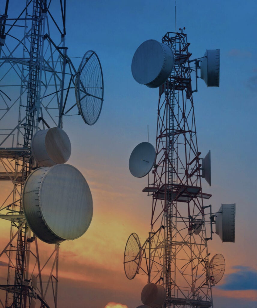 Image showing communication satellite towers at sunset.